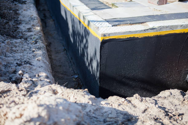 Professional Waterproofing technician working in Coopersville, MI